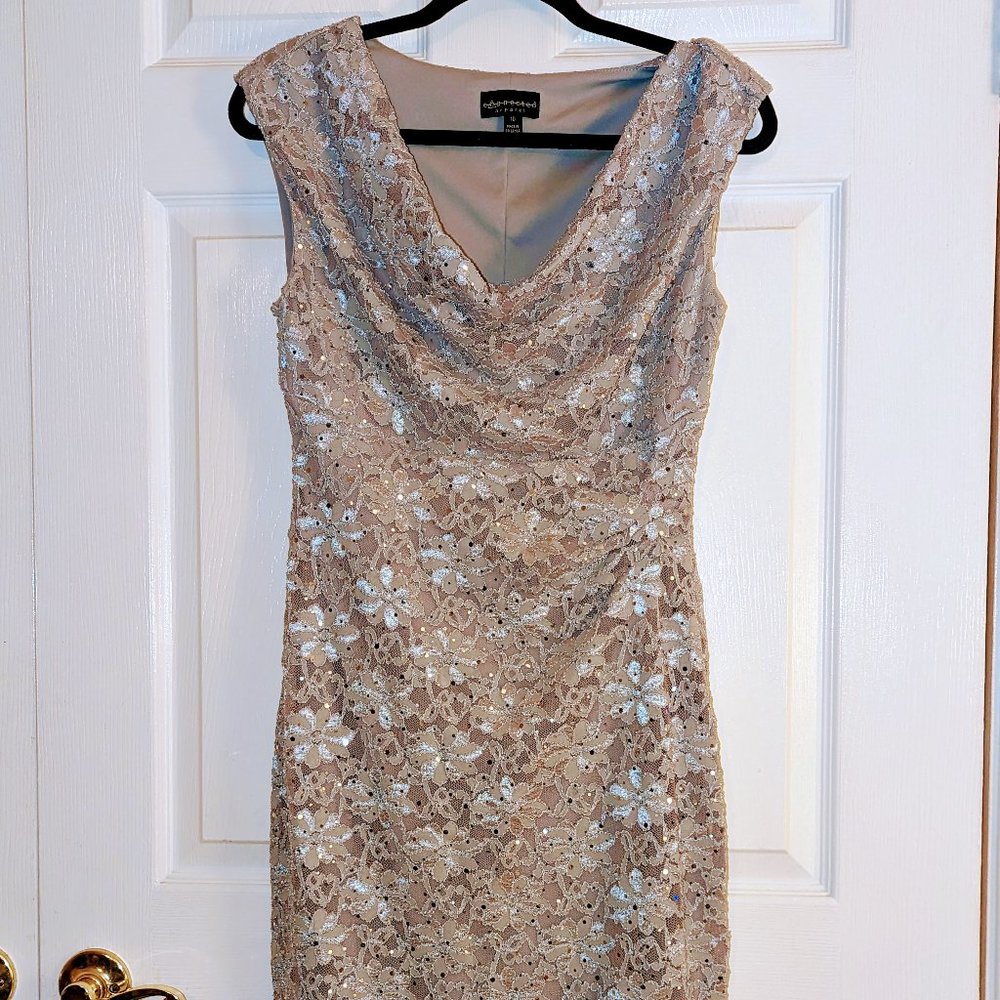 Sleeveless silver dress with silver lace overlay draped neckline with sequins